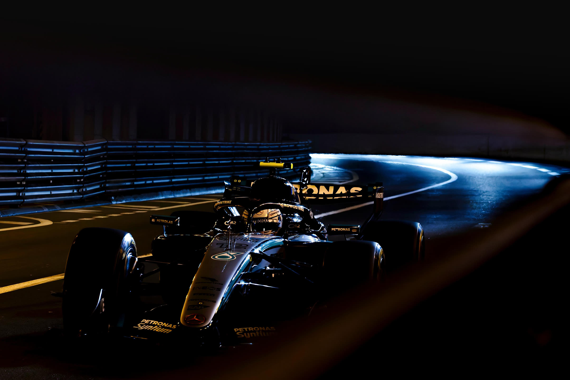 A Formula 1 car in the Monaco tunnel at night